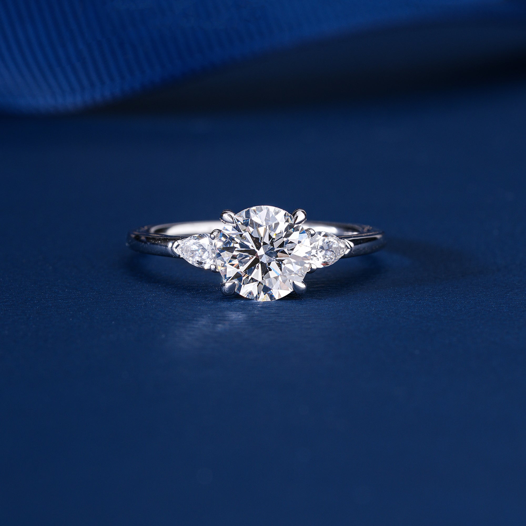 1.00 CT Round Diamond Three-Stone Ring with Pear Side Stones