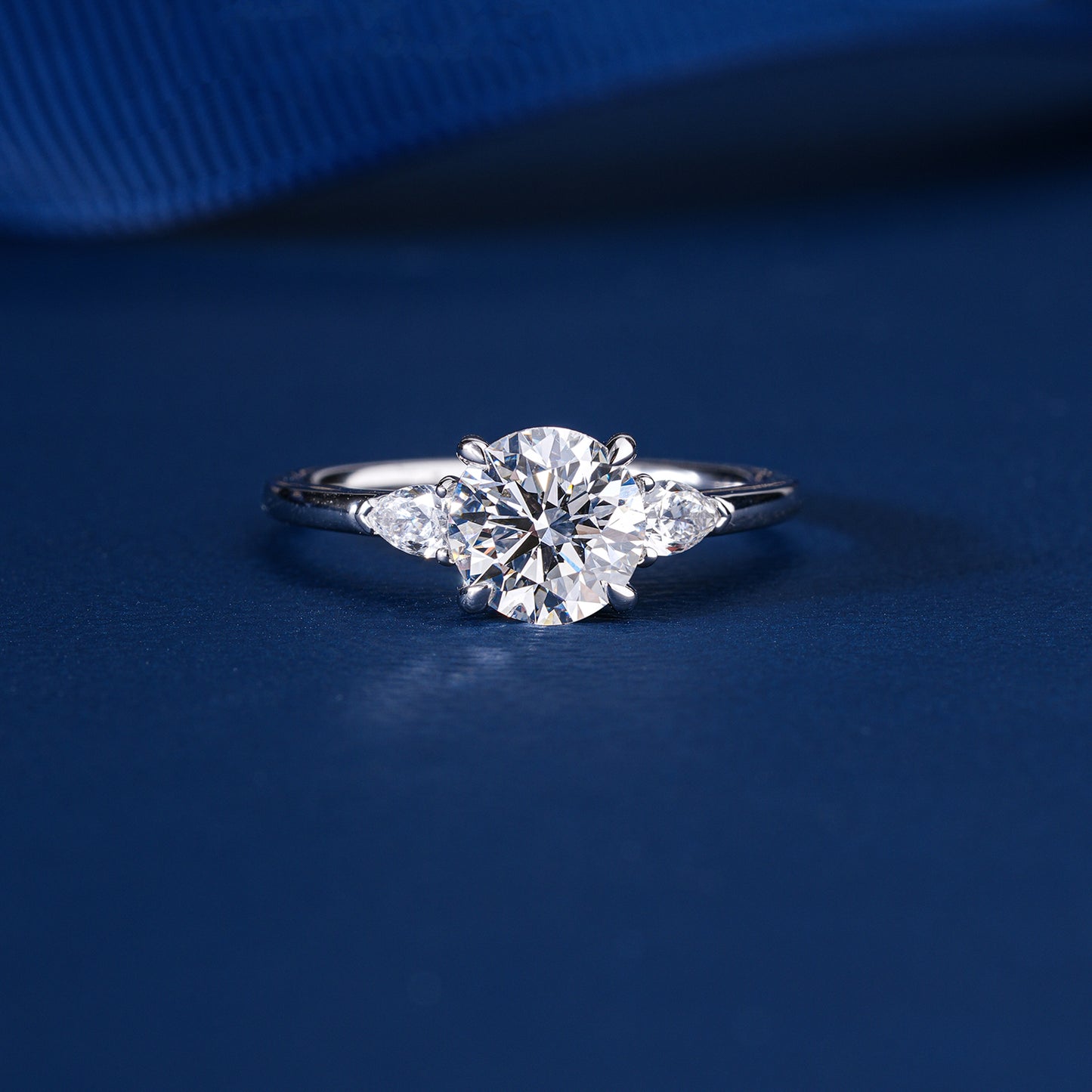 1.00 CT Round Diamond Three-Stone Ring with Pear Side Stones